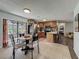 Cozy kitchen with a breakfast nook, stainless steel appliances, and a view of the patio at 11114 Lake Eustis Dr, Leesburg, FL 34788