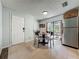 Eat in kitchen features tile flooring, stainless appliances and door to the exterior patio at 11114 Lake Eustis Dr, Leesburg, FL 34788