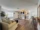Bright living room features new luxury vinyl plank flooring, modern built-in shelving, and fresh paint for a clean, inviting feel at 11114 Lake Eustis Dr, Leesburg, FL 34788