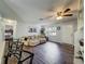 Spacious living room with hardwood floors, ceiling fan and natural light at 11114 Lake Eustis Dr, Leesburg, FL 34788