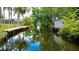 Scenic view of the canal with a private dock, perfect for boating and fishing at 11114 Lake Eustis Dr, Leesburg, FL 34788