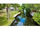 Picturesque waterfront property featuring a private dock and tranquil canal views at 11114 Lake Eustis Dr, Leesburg, FL 34788