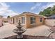 The backyard features a decorative fountain and a brick paved patio surrounded by the home's neutral stucco exterior at 1121 Ricardo Ave, The Villages, FL 32159
