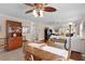 Open-concept dining area with a wooden table and plenty of natural light at 1121 Ricardo Ave, The Villages, FL 32159