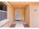 Covered front porch with tiled flooring and a security gate at 1121 Ricardo Ave, The Villages, FL 32159
