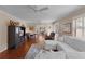 Comfortable living room featuring a ceiling fan and hardwood flooring at 1121 Ricardo Ave, The Villages, FL 32159