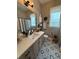 Bathroom featuring neutral tones, a white countertop, and decorative tile floors at 121 N Summit Ave, Lake Helen, FL 32744