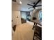 Upstairs bonus room featuring a ceiling fan, desk, and tv at 121 N Summit Ave, Lake Helen, FL 32744