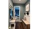 Inviting entryway with a bench, decor, and a glimpse into the bedroom at 121 N Summit Ave, Lake Helen, FL 32744