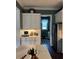 Well-organized kitchen featuring white cabinets, granite countertops, and stylish decor at 121 N Summit Ave, Lake Helen, FL 32744