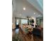 Spacious living room with a large TV, comfortable seating, and modern decor at 121 N Summit Ave, Lake Helen, FL 32744