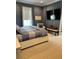 Spacious bedroom with a bench, a window, and carpet flooring at 121 N Summit Ave, Lake Helen, FL 32744