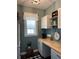 Charming pantry area with built-in cabinets, open shelving, and stylish decor at 121 N Summit Ave, Lake Helen, FL 32744