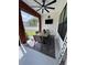 Enclosed patio featuring a dining table set, outdoor seating, and a view of the backyard at 121 N Summit Ave, Lake Helen, FL 32744