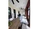 Covered outdoor porch with ceiling fan, outdoor furniture, and natural light at 121 N Summit Ave, Lake Helen, FL 32744