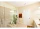 Bathroom showcasing a glass-enclosed shower and decorative towels at 1288 Grady Ln, Davenport, FL 33896
