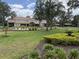 Lush landscaping frames the building, complemented by a putting green, offering a beautiful outdoor environment at 1288 Grady Ln, Davenport, FL 33896