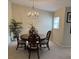 Cozy dining room featuring neutral walls, modern chandelier, and decorative accents at 1288 Grady Ln, Davenport, FL 33896