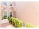 The front exterior shows a well-manicured landscape leading to the home's front door and windows at 1288 Grady Ln, Davenport, FL 33896