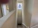 Bright foyer illuminated by a hanging light fixture from high ceilings at 1288 Grady Ln, Davenport, FL 33896