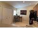 Stylish kitchen nook with black appliances, a dining table and bar stools at 1288 Grady Ln, Davenport, FL 33896