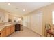 Efficient kitchen featuring tile floors, wood cabinets and modern appliances at 1288 Grady Ln, Davenport, FL 33896