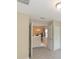 Open living space with dining area featuring modern chandelier, neutral walls and carpet at 1288 Grady Ln, Davenport, FL 33896