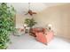 Bright, open living room with ample seating and large windows allowing lots of natural light at 1288 Grady Ln, Davenport, FL 33896