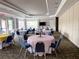 Spacious meeting room featuring round tables with floral centerpieces, ideal for community gatherings and events at 1288 Grady Ln, Davenport, FL 33896