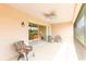 Large patio with comfortable seating and views of the community at 1288 Grady Ln, Davenport, FL 33896