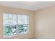 Bright room featuring a window with natural light and tree views at 1288 Grady Ln, Davenport, FL 33896