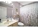Standard bathroom featuring a vanity with storage, toilet, and shower with curtain at 1318 Guerra Ave, The Villages, FL 32159
