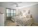 Bright bedroom with twin beds, hardwood floors, and natural light at 1318 Guerra Ave, The Villages, FL 32159