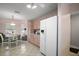 Bright kitchen featuring tile floors, modern appliances, and access to breakfast nook at 1318 Guerra Ave, The Villages, FL 32159