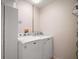 Functional laundry room featuring modern washing machine and dryer, plus built-in storage cabinet at 1318 Guerra Ave, Lady Lake, FL 32159
