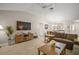 Living room featuring a vaulted ceiling, flat screen television, and wood-look tile floors at 1318 Guerra Ave, The Villages, FL 32159