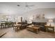 Bright living room featuring wood floors, a ceiling fan, and stylish furniture at 1318 Guerra Ave, Lady Lake, FL 32159
