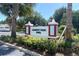 Liberty Park Pool community sign surrounded by vibrant landscaping at 1404 Georgiana Ter, The Villages, FL 32162