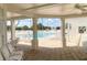 Covered poolside view with comfortable seating and a clear view of the pool at 1404 Georgiana Ter, The Villages, FL 32162