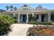Allamanda Recreation Center featuring a welcoming entrance and beautiful landscaping at 1404 Georgiana Ter, The Villages, FL 32162