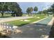 Community shuffleboard and horseshoe area with scenic golf course views at 1404 Georgiana Ter, The Villages, FL 32162