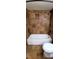 Bathroom with bath and shower featuring updated fixtures and warm earth-toned tile at 14049 Fairway Island Dr # 118, Orlando, FL 32837