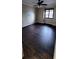 Neutral bedroom with dark wood floors, ceiling fan and window at 14049 Fairway Island Dr # 118, Orlando, FL 32837
