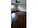 Bedroom featuring dark tile floors, a ceiling fan, and a window providing natural light at 14049 Fairway Island Dr # 118, Orlando, FL 32837