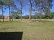 Expansive community green space featuring mature trees and open lawns, perfect for outdoor activities and relaxation at 14049 Fairway Island Dr # 118, Orlando, FL 32837