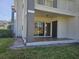 Covered patio with tile flooring and sliding door access to the home at 14049 Fairway Island Dr # 118, Orlando, FL 32837