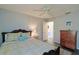 Bright bedroom with a ceiling fan, neutral colors, and a well-dressed bed, creating a relaxing atmosphere at 1451 Rosedale Way, The Villages, FL 32162