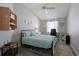 Cozy bedroom with coastal decor, soft lighting, and comfortable furnishings for a peaceful retreat at 1451 Rosedale Way, The Villages, FL 32162