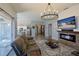 Open-concept living space featuring kitchen view, fireplace, and sliding doors to outdoor area at 1451 Rosedale Way, The Villages, FL 32162