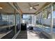 Relaxing screened patio with comfortable seating and stylish decor, perfect for outdoor enjoyment at 1451 Rosedale Way, The Villages, FL 32162
